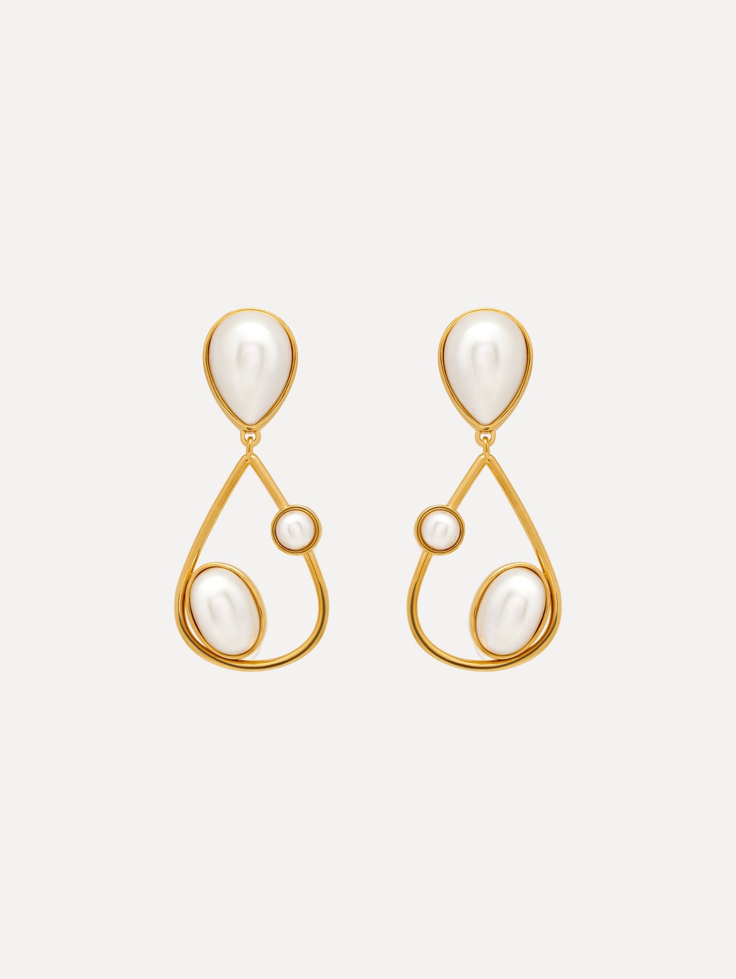 Pearl Cabochon Drop Clip-On Earrings with three pearls and a gold pear shaped drop. Front View.