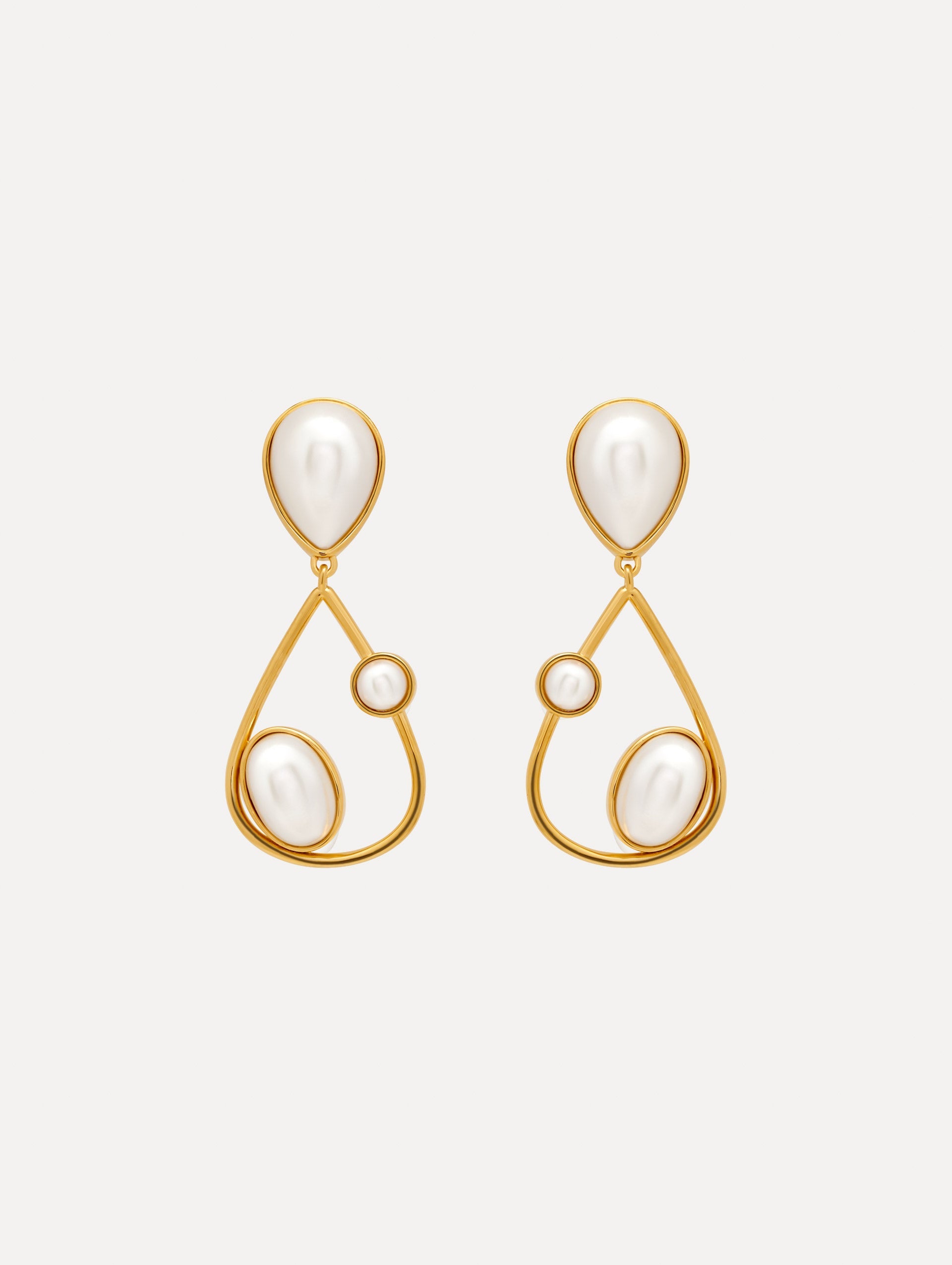 Pearl Cabochon Drop Clip-On Earrings with three pearls and a gold pear shaped drop. Front View.