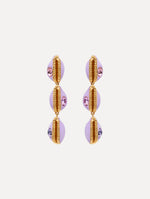 Enamel Cowrie Shell Clip-On Earrings in the color Lilac Purple. Featuring stacked cowrie shells with gold and rhinestone accents.