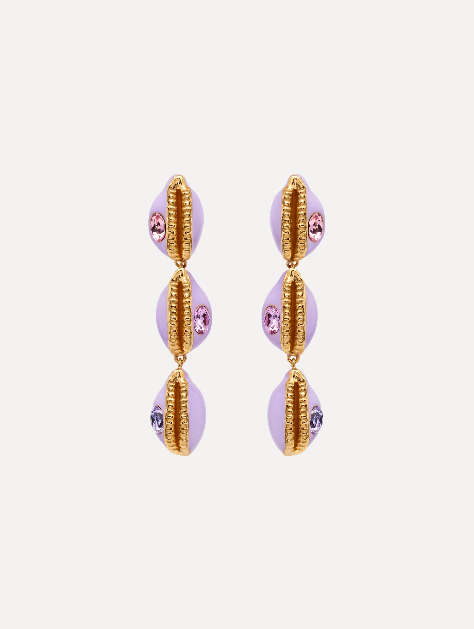 Enamel Cowrie Shell Clip-On Earrings in the color Lilac Purple. Featuring stacked cowrie shells with gold and rhinestone accents.