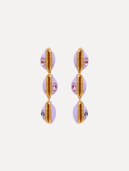 Enamel Cowrie Shell Clip-On Earrings in the color Lilac Purple. Featuring stacked cowrie shells with gold and rhinestone accents.