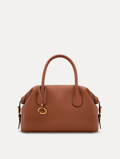 The Mini Dahlia in Cognac Brown. This mini duffle bag has top handles and a removable shoulder strap. Detailed with Oscar de la Renta signature O emblem on the hangtag. Front View