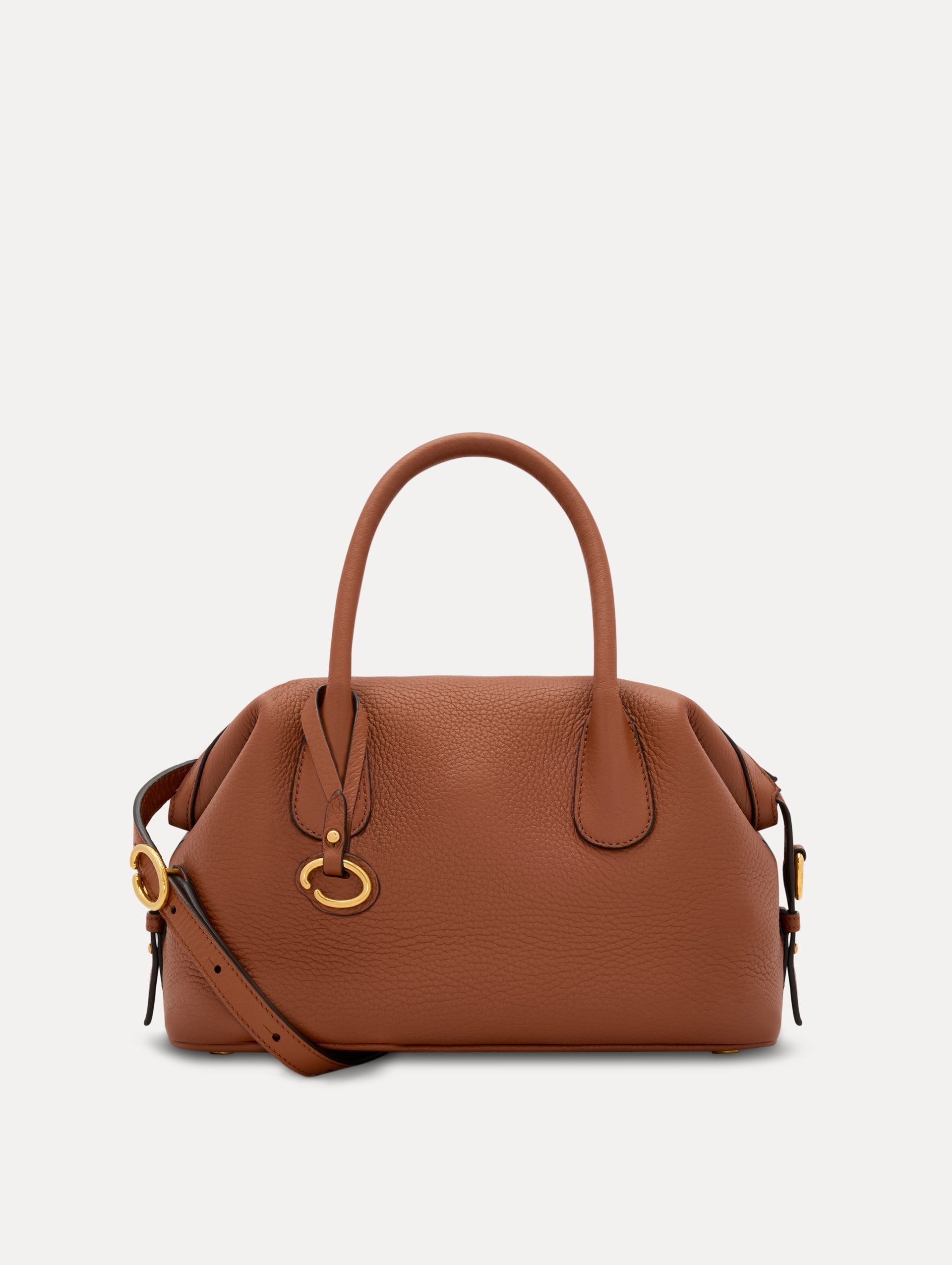 The Mini Dahlia in Cognac Brown. This mini duffle bag has top handles and a removable shoulder strap. Detailed with Oscar de la Renta signature O emblem on the hangtag. Front View